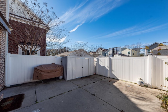 view of patio / terrace with a storage shed