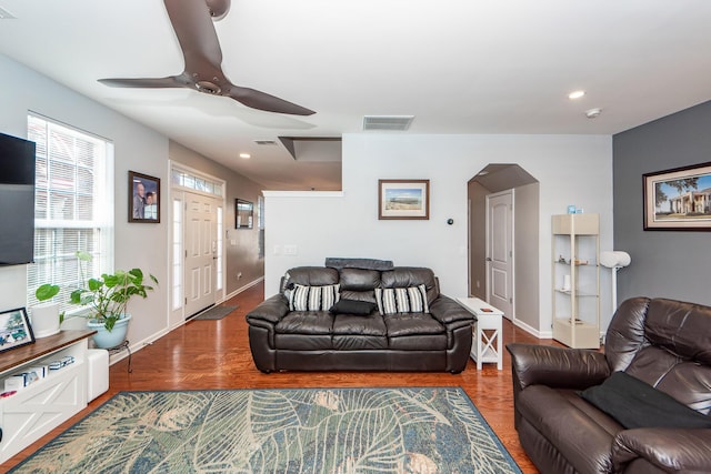 living room with ceiling fan and hardwood / wood-style floors