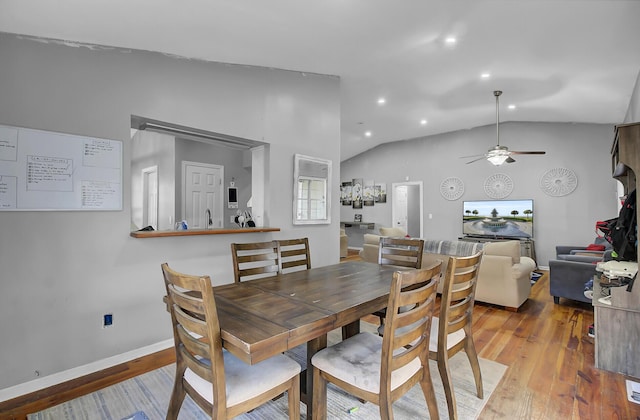 dining area featuring ceiling fan, recessed lighting, vaulted ceiling, and wood finished floors