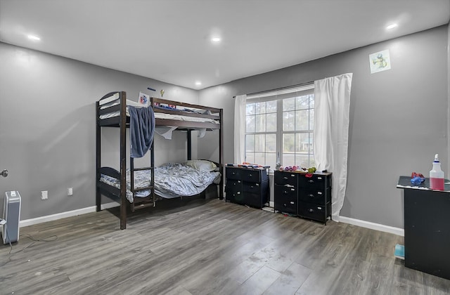 bedroom featuring recessed lighting, baseboards, and wood finished floors