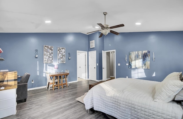 bedroom with recessed lighting, ceiling fan, vaulted ceiling, wood finished floors, and baseboards