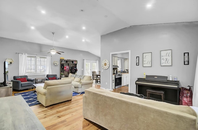 living room with light wood-style floors, recessed lighting, vaulted ceiling, and a ceiling fan