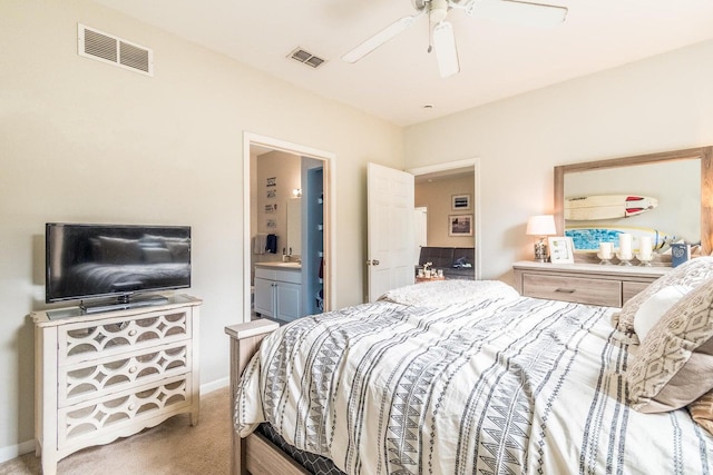 carpeted bedroom featuring ceiling fan, sink, and ensuite bathroom