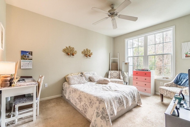 bedroom featuring ceiling fan and light carpet