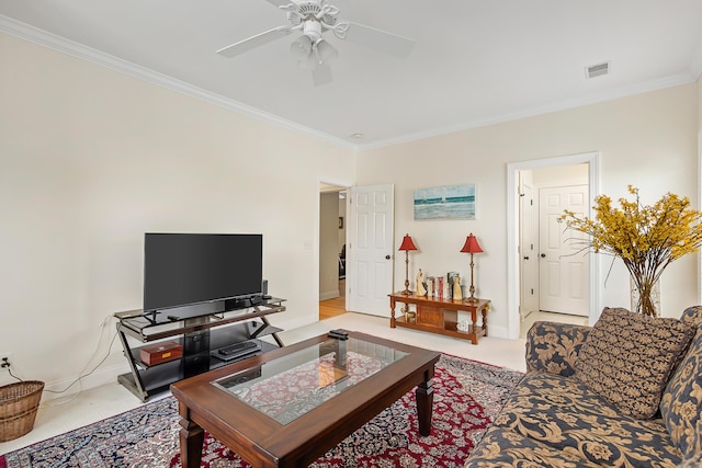 living area featuring baseboards, ornamental molding, a ceiling fan, and visible vents