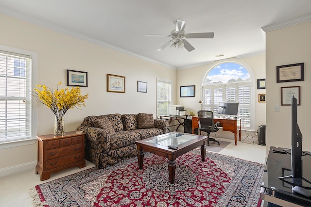 carpeted living area featuring crown molding, a ceiling fan, baseboards, and visible vents