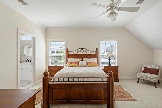 bedroom featuring light colored carpet, a sink, ensuite bath, a ceiling fan, and baseboards