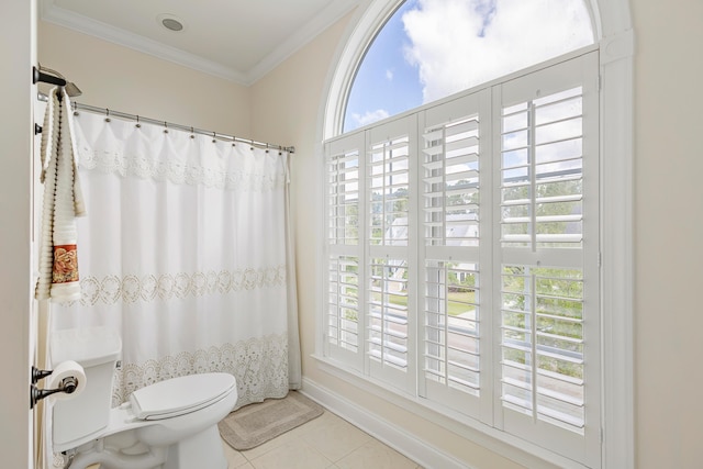 bathroom featuring crown molding, tile patterned floors, toilet, and a shower with curtain