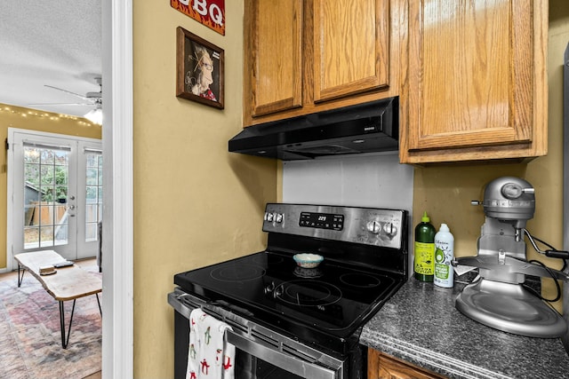 kitchen featuring french doors, ceiling fan, stainless steel range with electric cooktop, and a textured ceiling