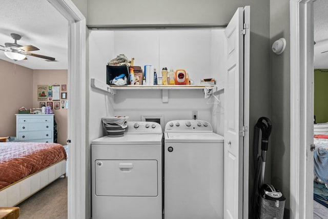 laundry room featuring separate washer and dryer, a textured ceiling, ceiling fan, and carpet flooring