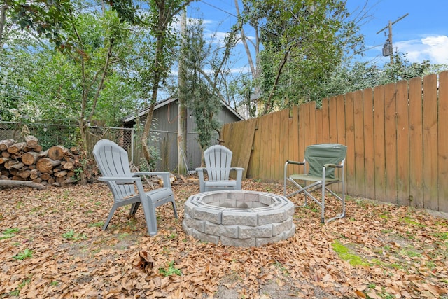 view of patio / terrace featuring an outdoor fire pit