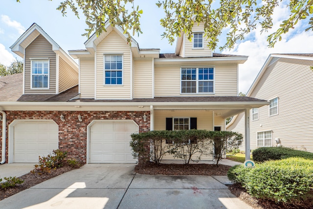 townhome / multi-family property featuring a garage