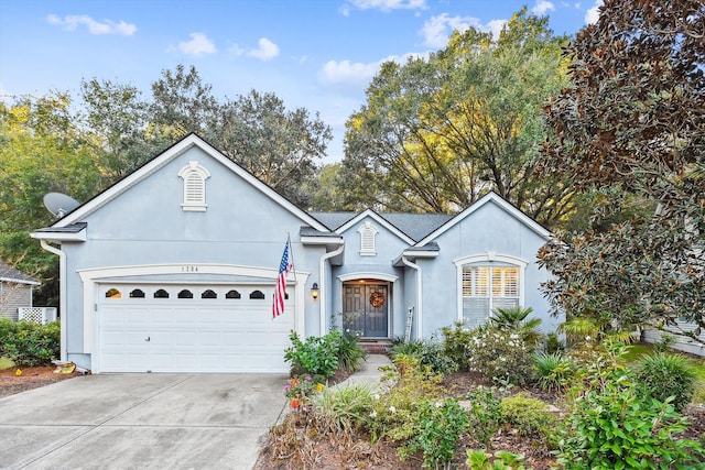 ranch-style house featuring a garage