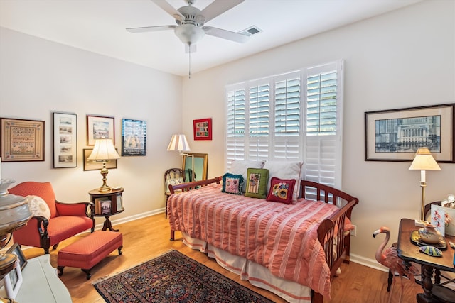 bedroom featuring light wood-type flooring and ceiling fan