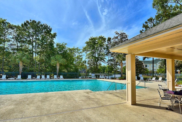 view of swimming pool featuring a patio