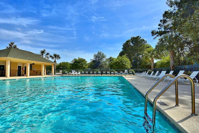 view of swimming pool with a patio area