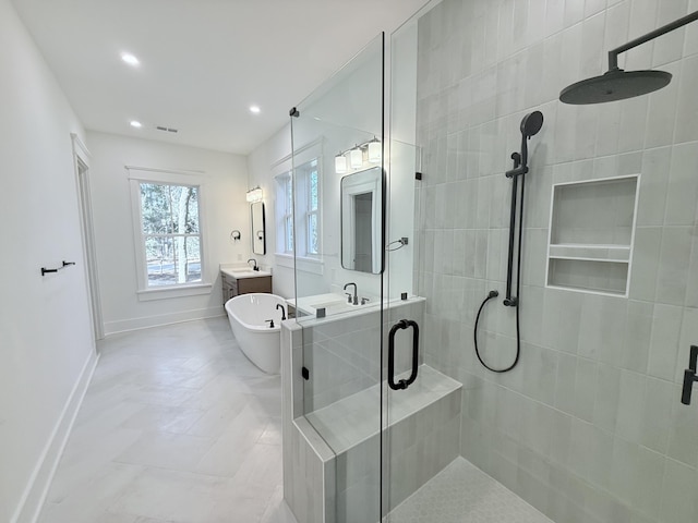 bathroom featuring vanity and separate shower and tub