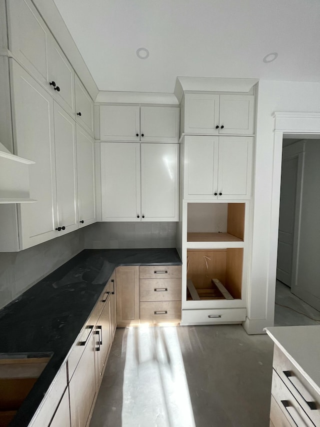 kitchen featuring white cabinetry and sink