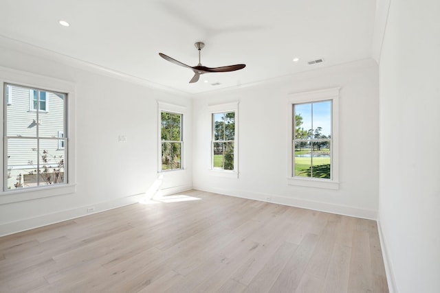 spare room with crown molding, light hardwood / wood-style flooring, and ceiling fan