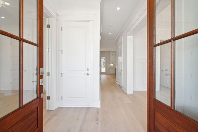 corridor with light wood-type flooring