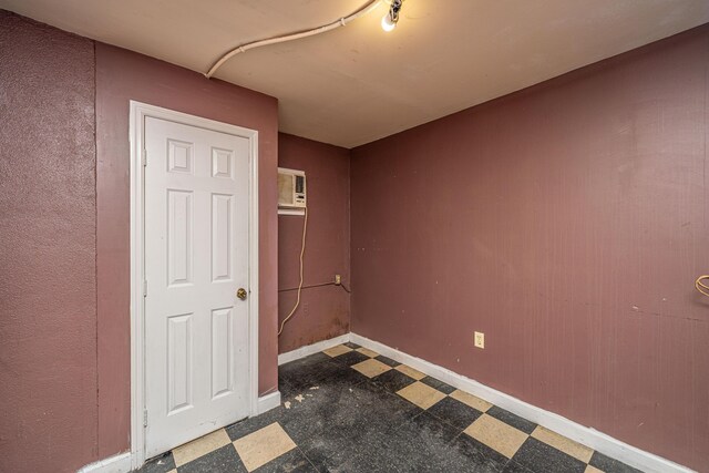 113 America St Unit A, B, C, D, Charleston, SC 29403 - spare room featuring tile patterned floors, a wall unit AC, and baseboards