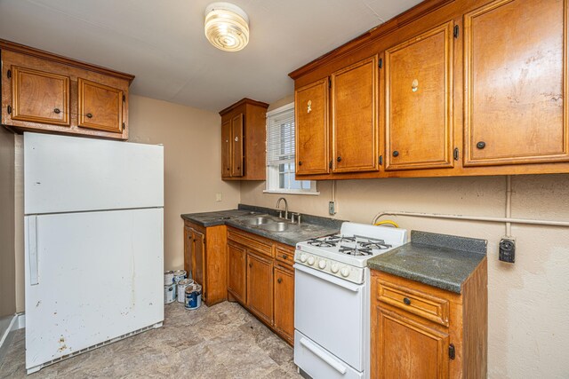 113 America St Unit A, B, C, D, Charleston, SC 29403 - kitchen featuring white appliances, a sink, brown cabinetry, and dark countertops