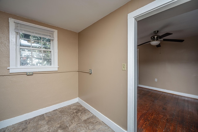 spare room with ceiling fan and hardwood / wood-style flooring