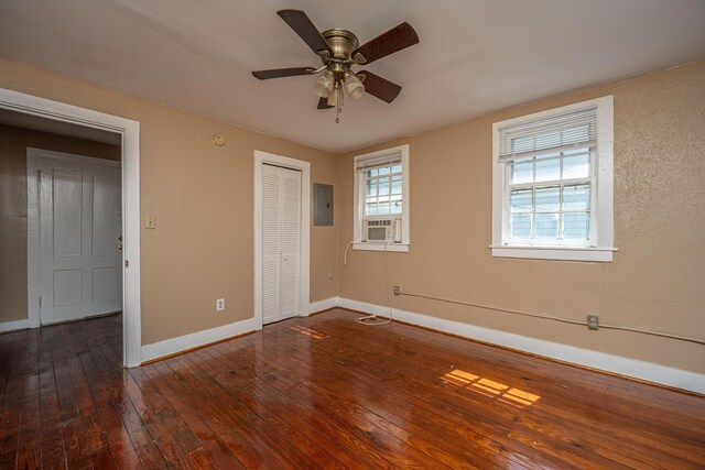 113 America St Unit A, B, C, D, Charleston, SC 29403 - unfurnished bedroom featuring electric panel, baseboards, wood-type flooring, a closet, and cooling unit