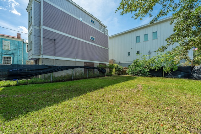 rear view of house featuring a yard