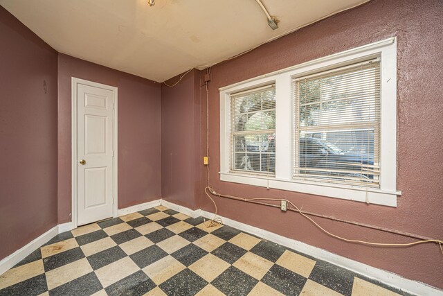 113 America St Unit A, B, C, D, Charleston, SC 29403 - spare room featuring tile patterned floors and baseboards
