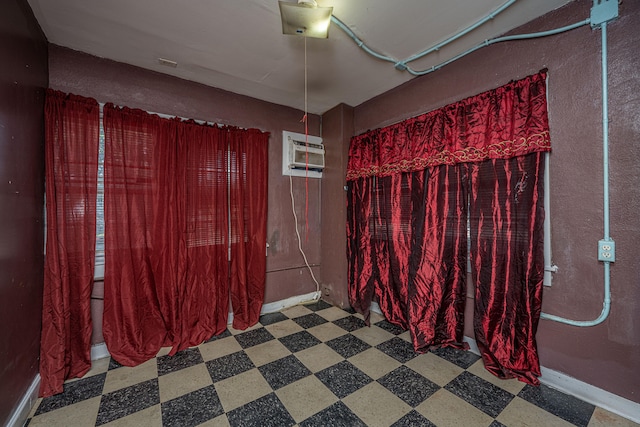 empty room featuring a wall unit AC