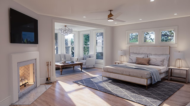 3307 Waterway Blvd, Isle Of Palms, SC 29451 - bedroom with light wood finished floors, recessed lighting, a chandelier, and ceiling fan