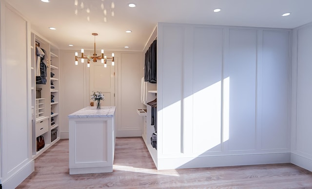 3307 Waterway Blvd, Isle Of Palms, SC 29451 - walk in closet with a chandelier and light wood-style flooring