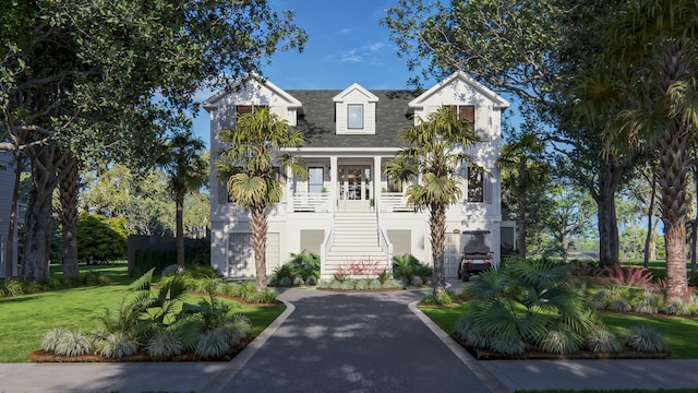 3307 Waterway Blvd, Isle Of Palms, SC 29451 - coastal home with stairway, a shingled roof, and a front yard