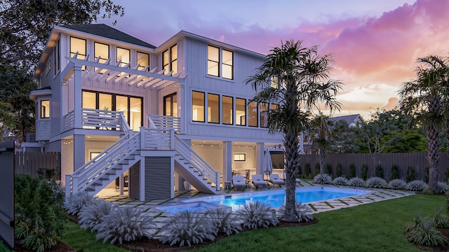 3307 Waterway Blvd, Isle Of Palms, SC 29451 - rear view of house featuring stairway, a pergola, and board and batten siding