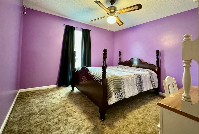 bedroom with ceiling fan, carpet floors, and a textured ceiling