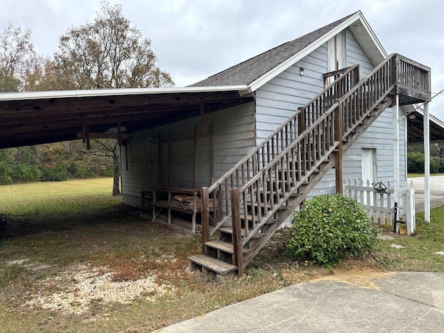 view of side of home with a carport