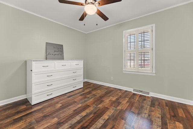 unfurnished bedroom with crown molding, dark wood-type flooring, and ceiling fan