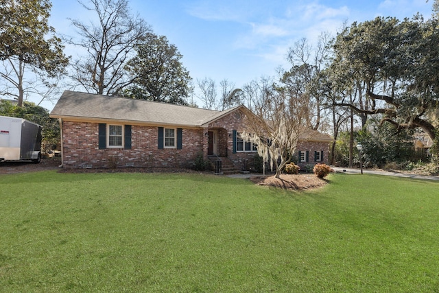 rear view of house featuring a yard