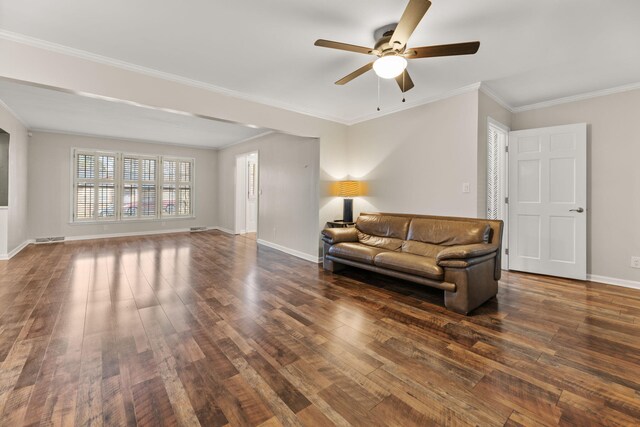 living room with crown molding, dark hardwood / wood-style floors, and ceiling fan