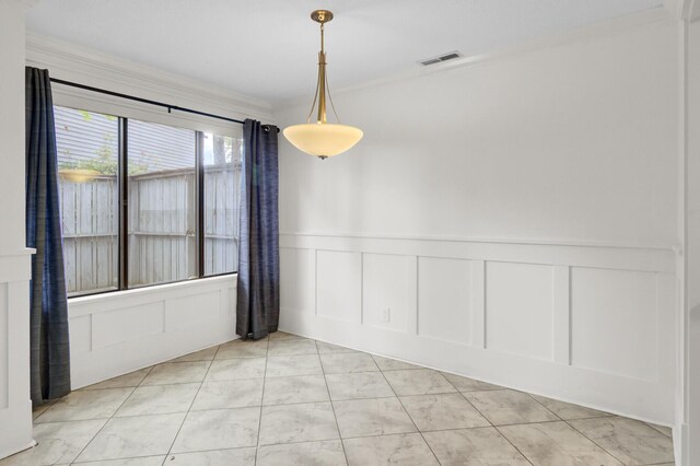2159 Spoleto Ln Unit E, North Charleston, SC 29406 - spare room featuring a decorative wall, light marble finish flooring, and wainscoting