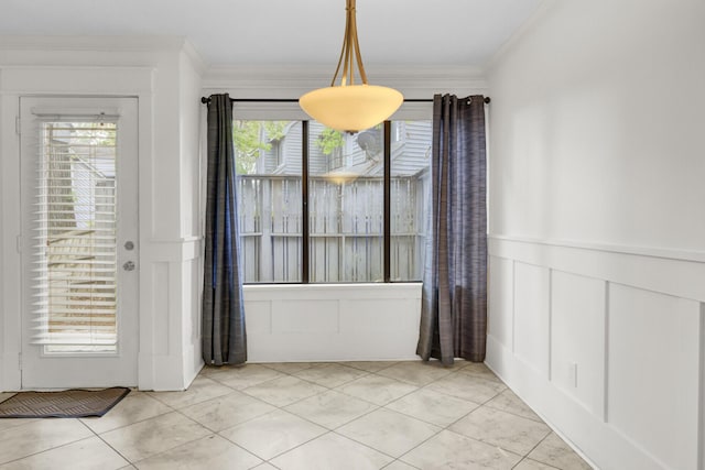 2159 Spoleto Ln Unit E, North Charleston, SC 29406 - unfurnished dining area with a decorative wall, ornamental molding, light tile patterned floors, and a wainscoted wall
