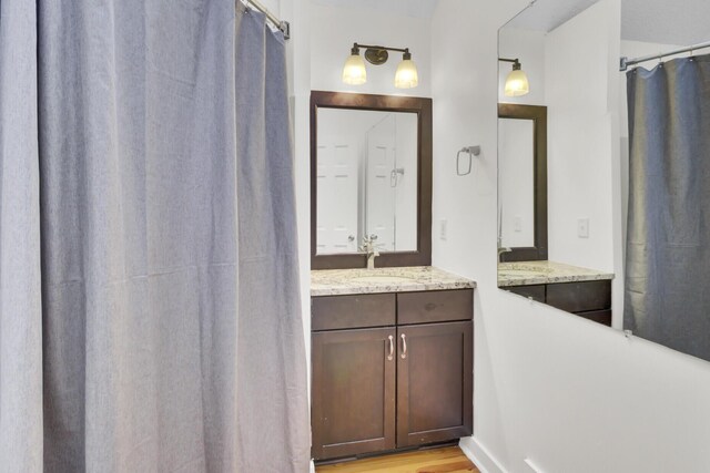2159 Spoleto Ln Unit E, North Charleston, SC 29406 - bathroom with vanity, a shower with shower curtain, and wood finished floors