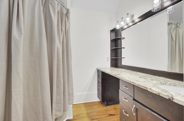2159 Spoleto Ln Unit E, North Charleston, SC 29406 - bathroom featuring vanity, wood finished floors, baseboards, and a shower with shower curtain