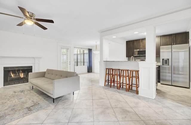 2159 Spoleto Ln Unit E, North Charleston, SC 29406 - living room featuring a lit fireplace, a ceiling fan, and recessed lighting