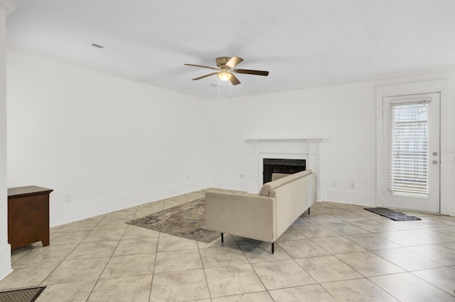 2159 Spoleto Ln Unit E, North Charleston, SC 29406 - unfurnished living room with ceiling fan, light tile patterned floors, a fireplace, and baseboards
