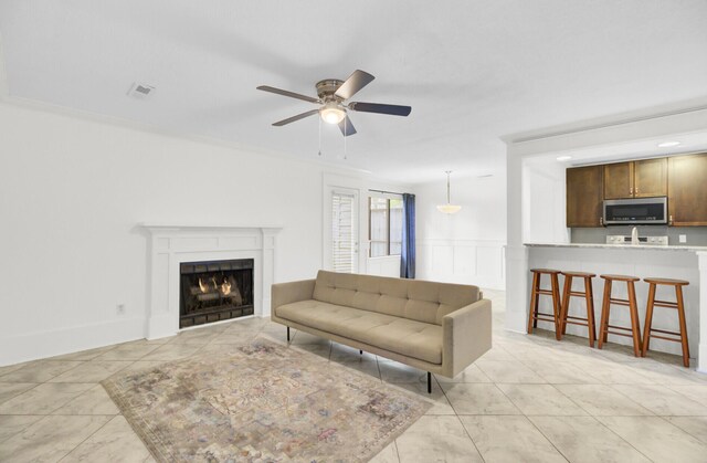 2159 Spoleto Ln Unit E, North Charleston, SC 29406 - living area with ceiling fan, a warm lit fireplace, and light marble finish floors