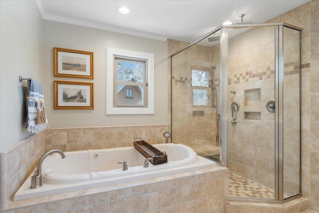 bathroom featuring a shower stall, a garden tub, and ornamental molding