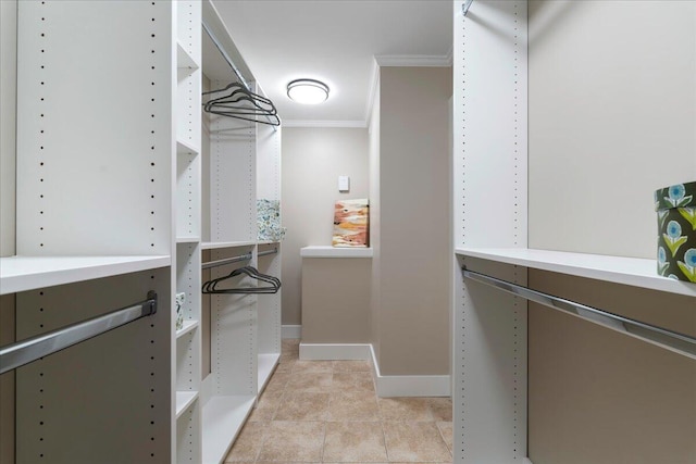 walk in closet featuring light tile patterned floors