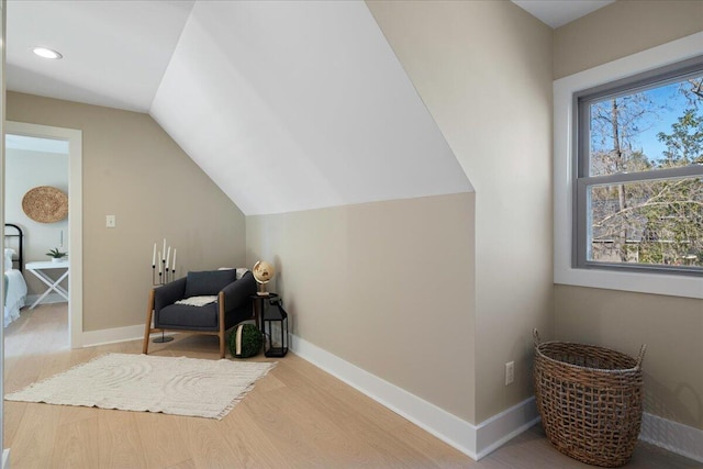 additional living space featuring lofted ceiling, recessed lighting, wood finished floors, and baseboards